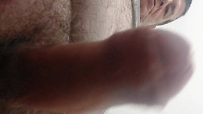 Masturbating the penis.